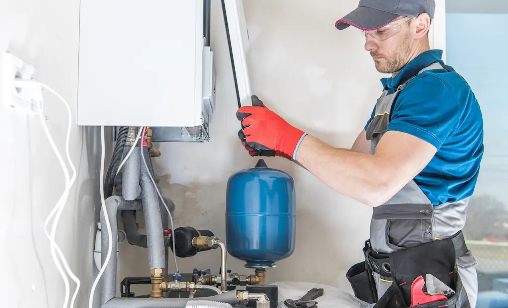 A technician is maintaining a boiler