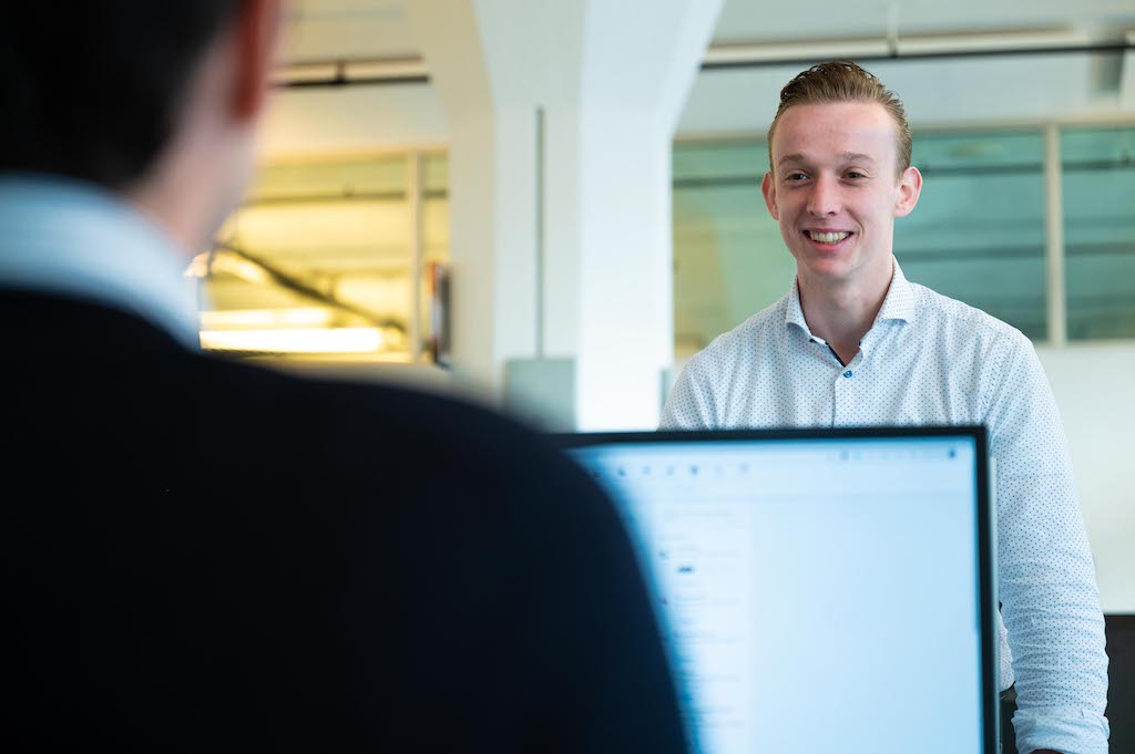 Employees at work in the Bluace team